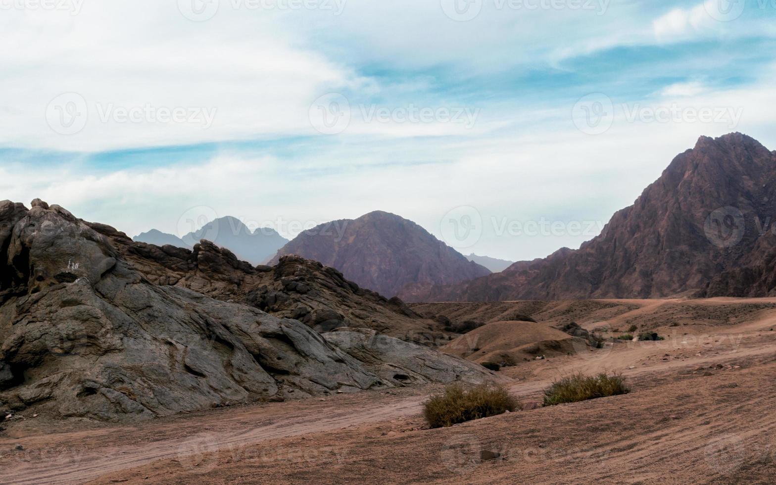 Desert with rocky mountains photo
