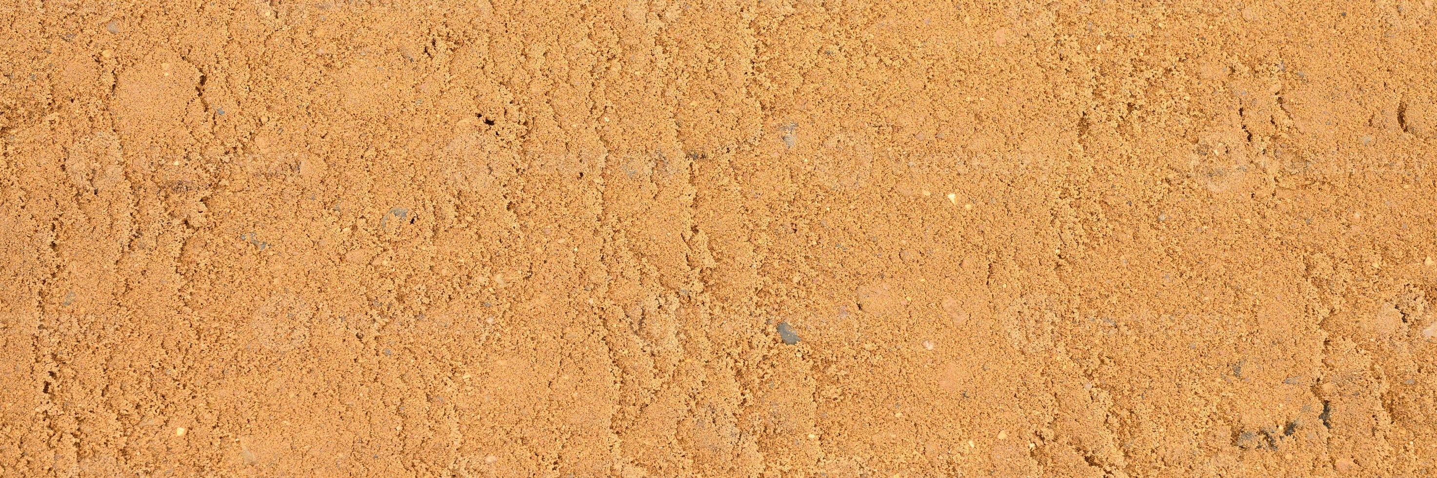 Background texture from the smooth surface of the sand photo