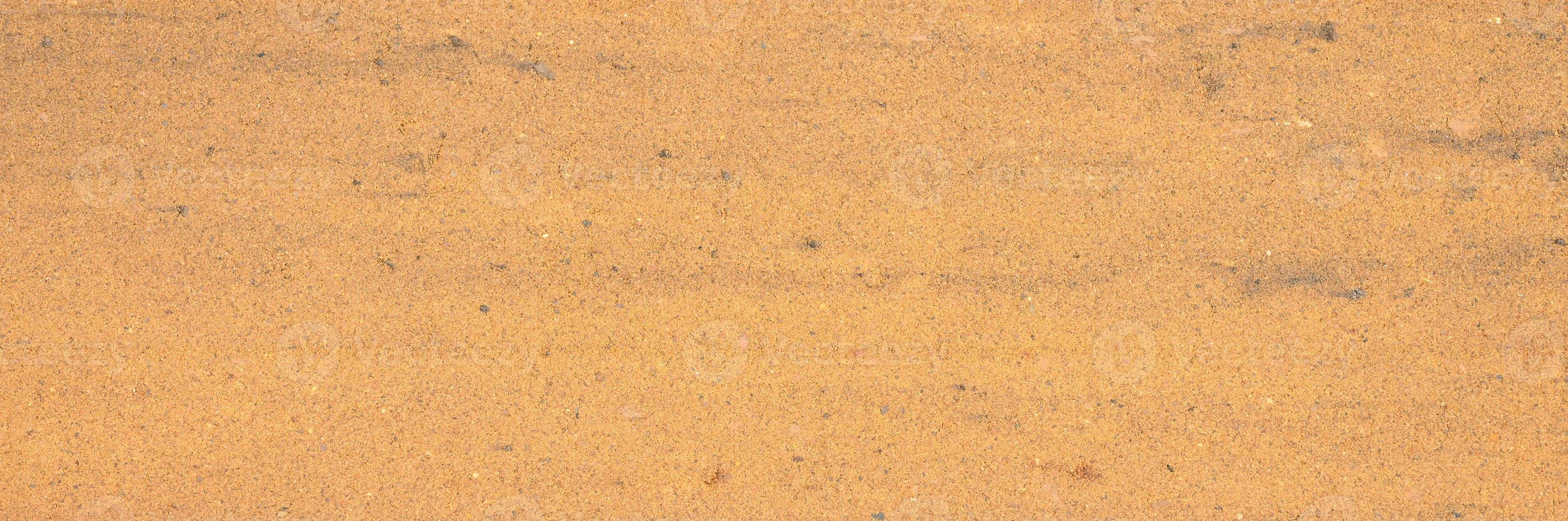 Background texture from the smooth surface of the sand photo