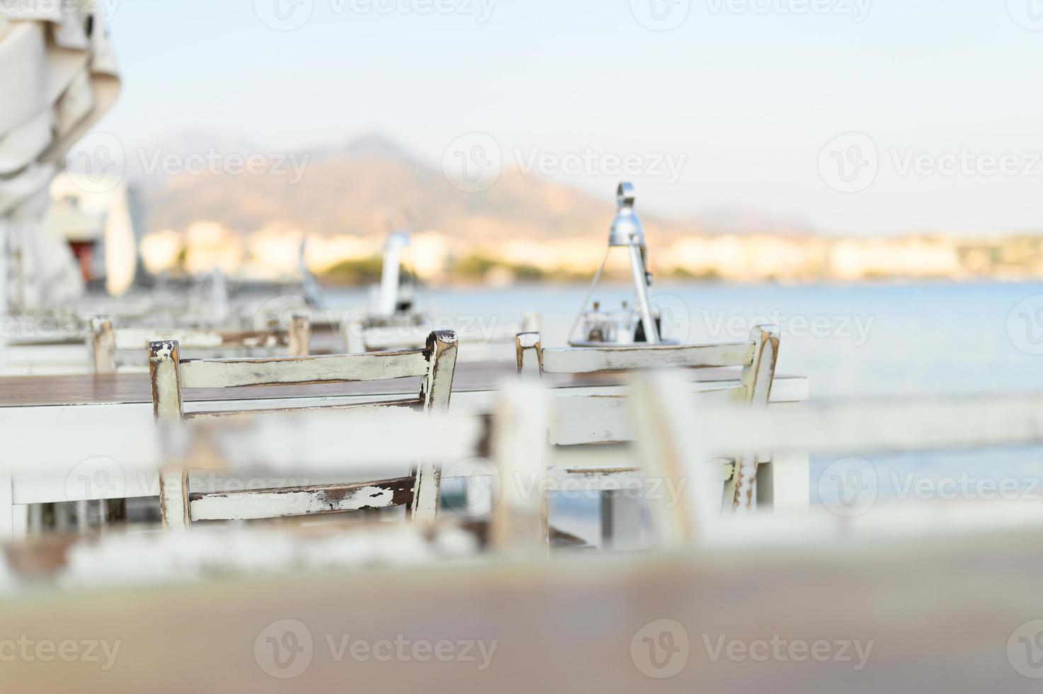Cafe tables on the sea mediterranean embankment photo