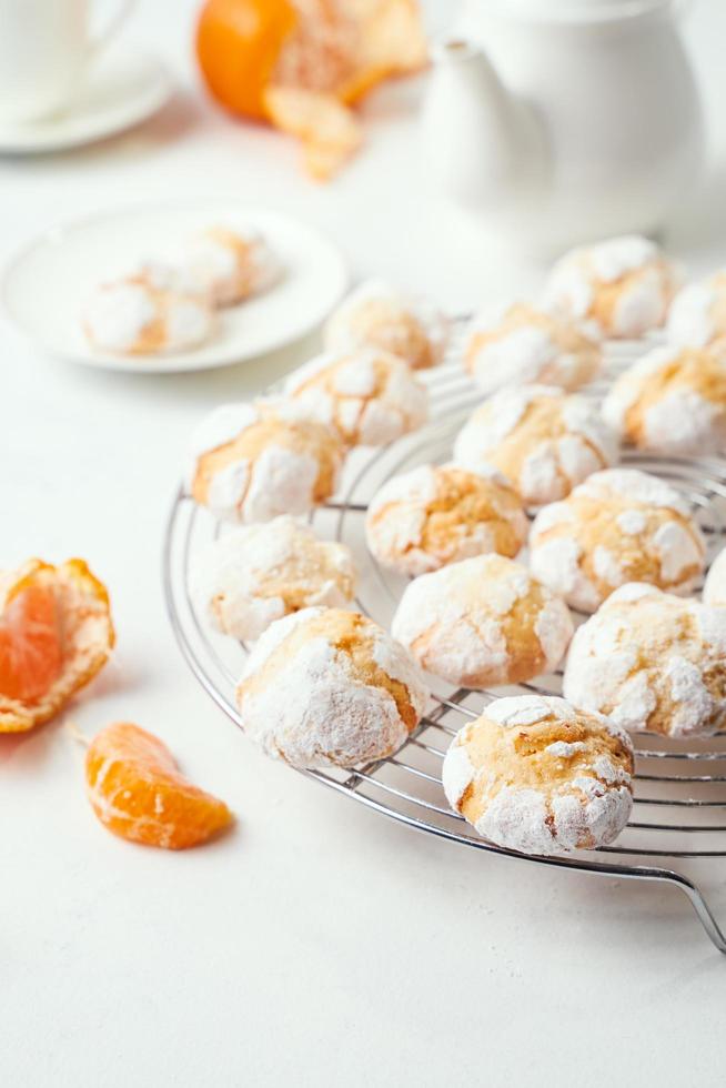 Home baked racked clementine cookies on baking rack photo