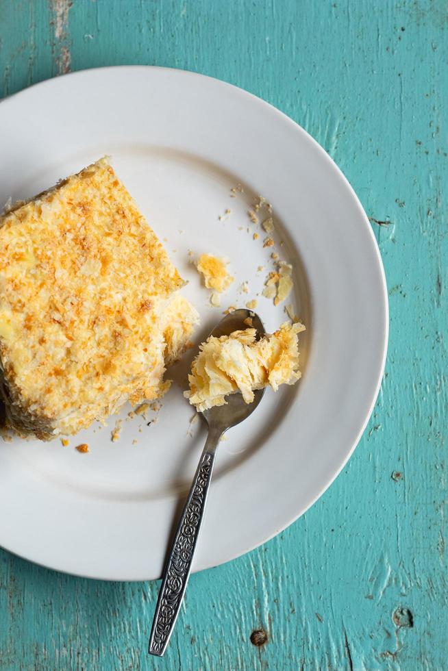 Homemade mille-feuille, puff pastry custard cream pie on blue wooden background photo