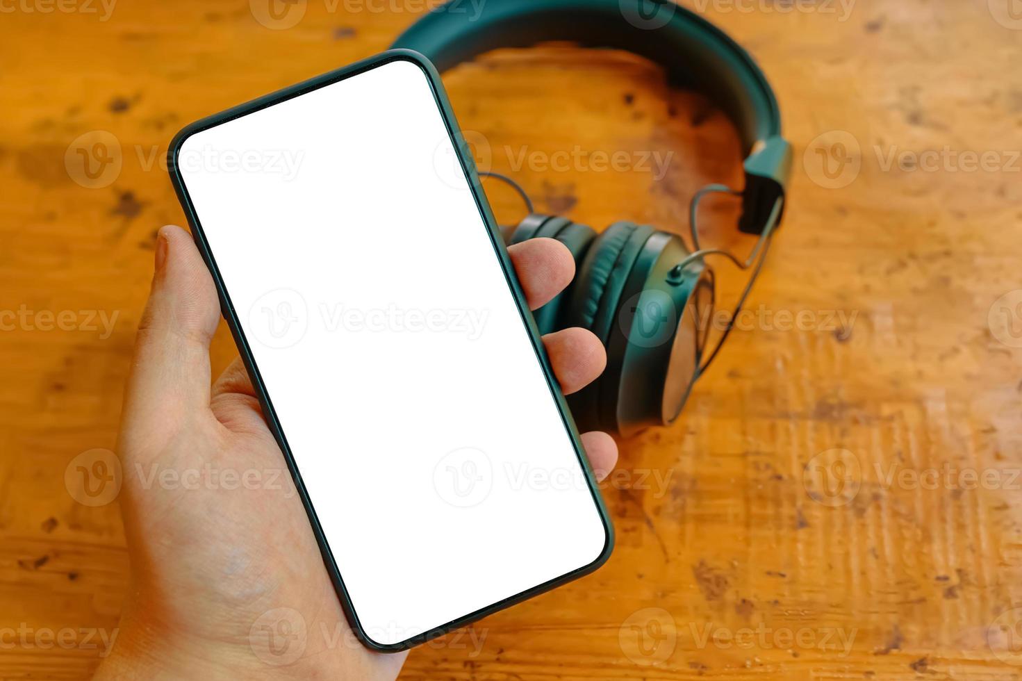 Mobile phone and wireless headphones photo