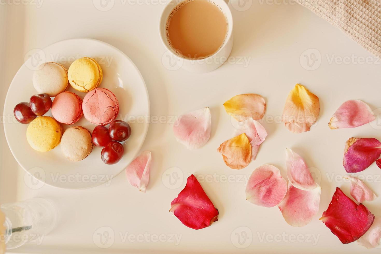 Romantic breakfast in bed with macaroons photo