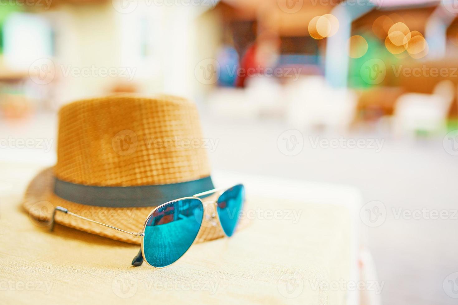 Hat and glasses on the table photo