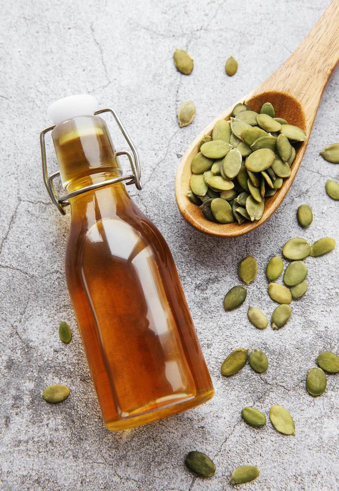 Bottle with pumpkin seed oil photo