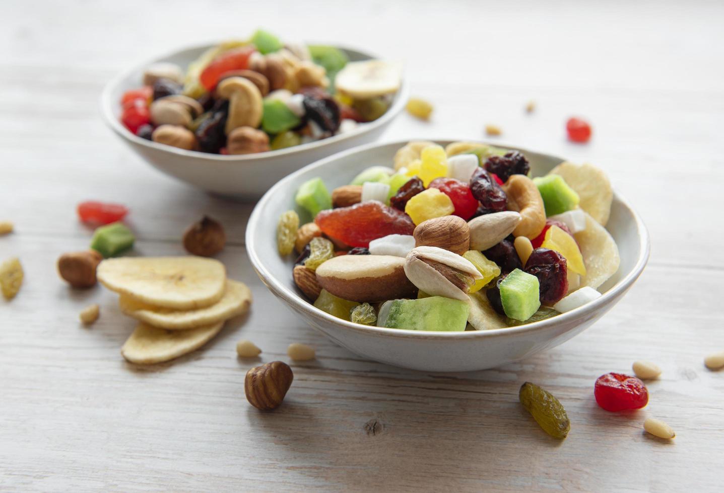 Bowls with various dried fruits and nuts photo