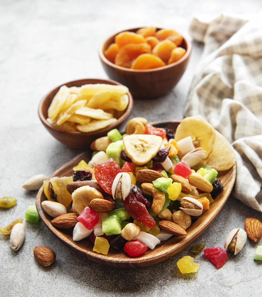 Bowls with various dried fruits and nuts photo