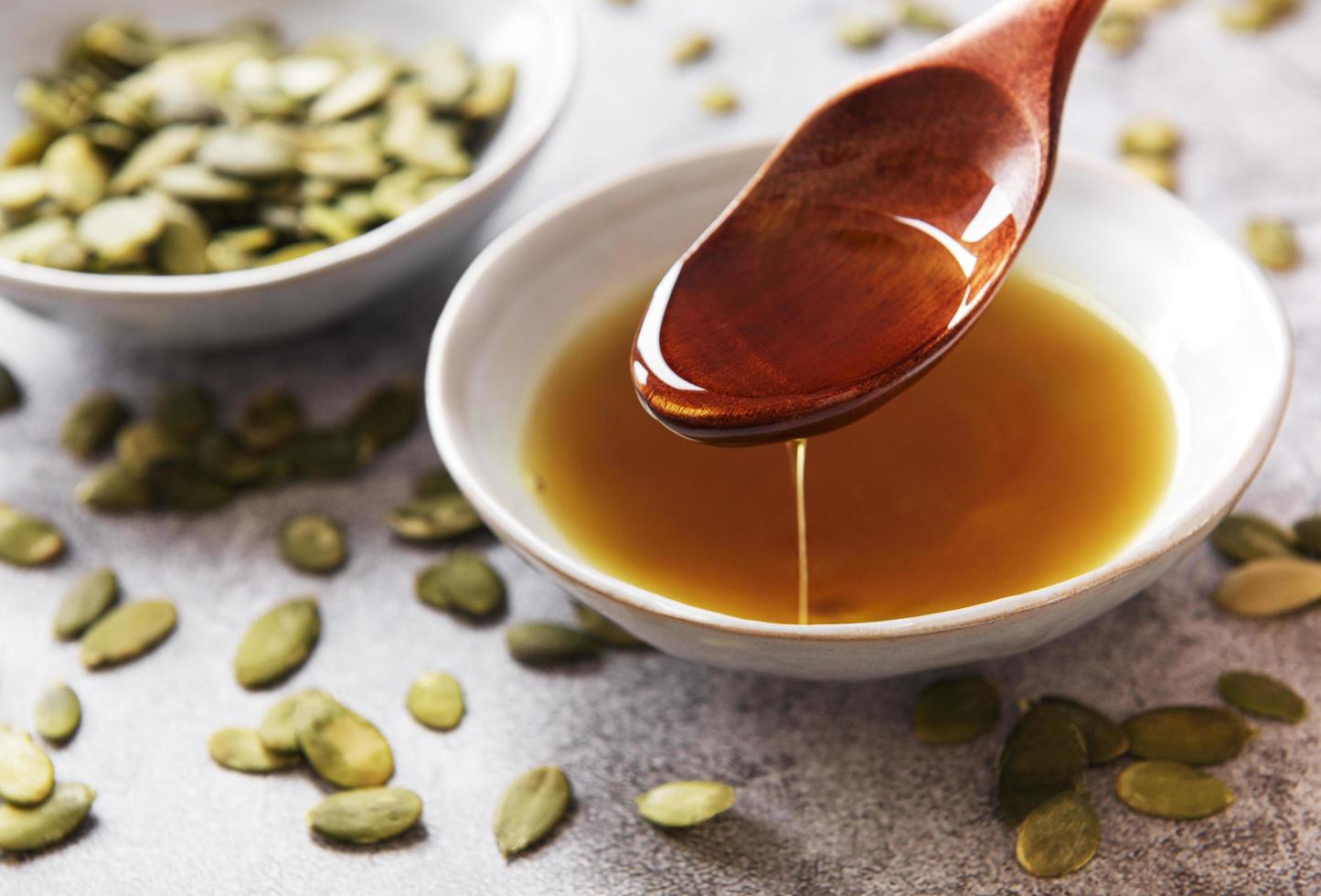 Bowl with pumpkin seed oil photo