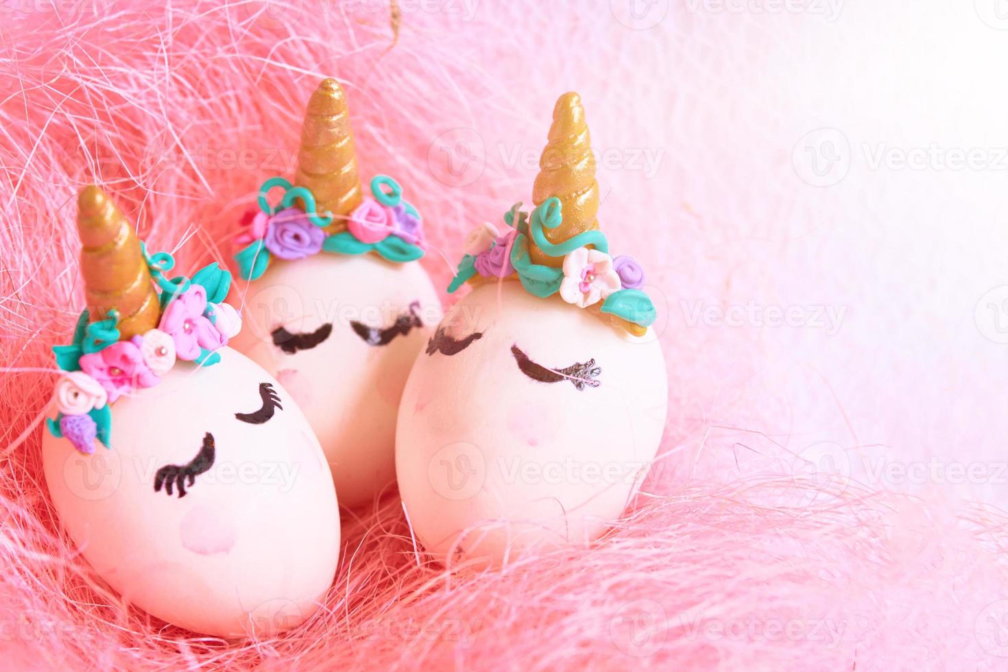 Easter eggs unicorns in nest photo