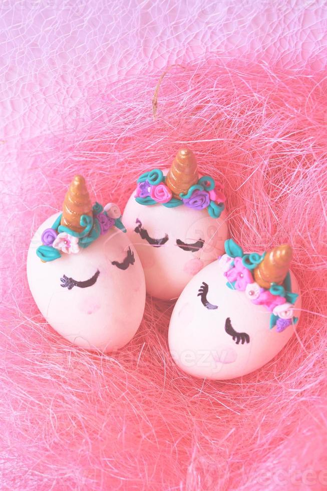 Easter eggs unicorns in nest photo