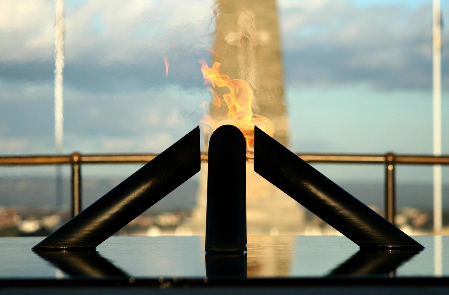 War memorial behind flames photo