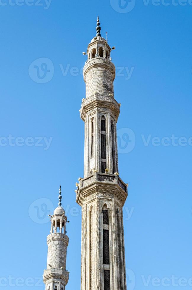 Two minarets of the mosque El-Mustafa in Sharm El Sheikh photo