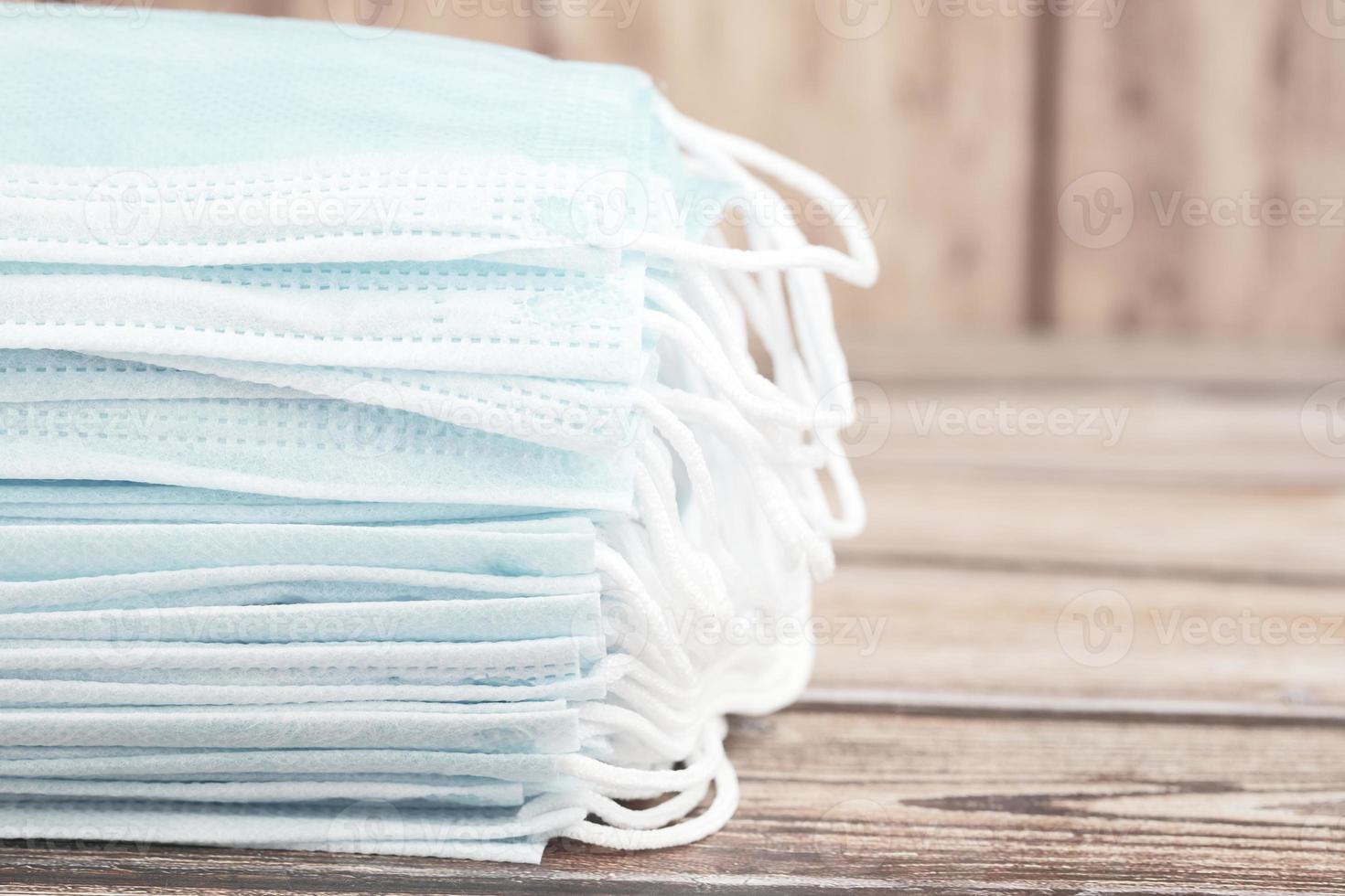 Close up of blue surgical masks on table photo