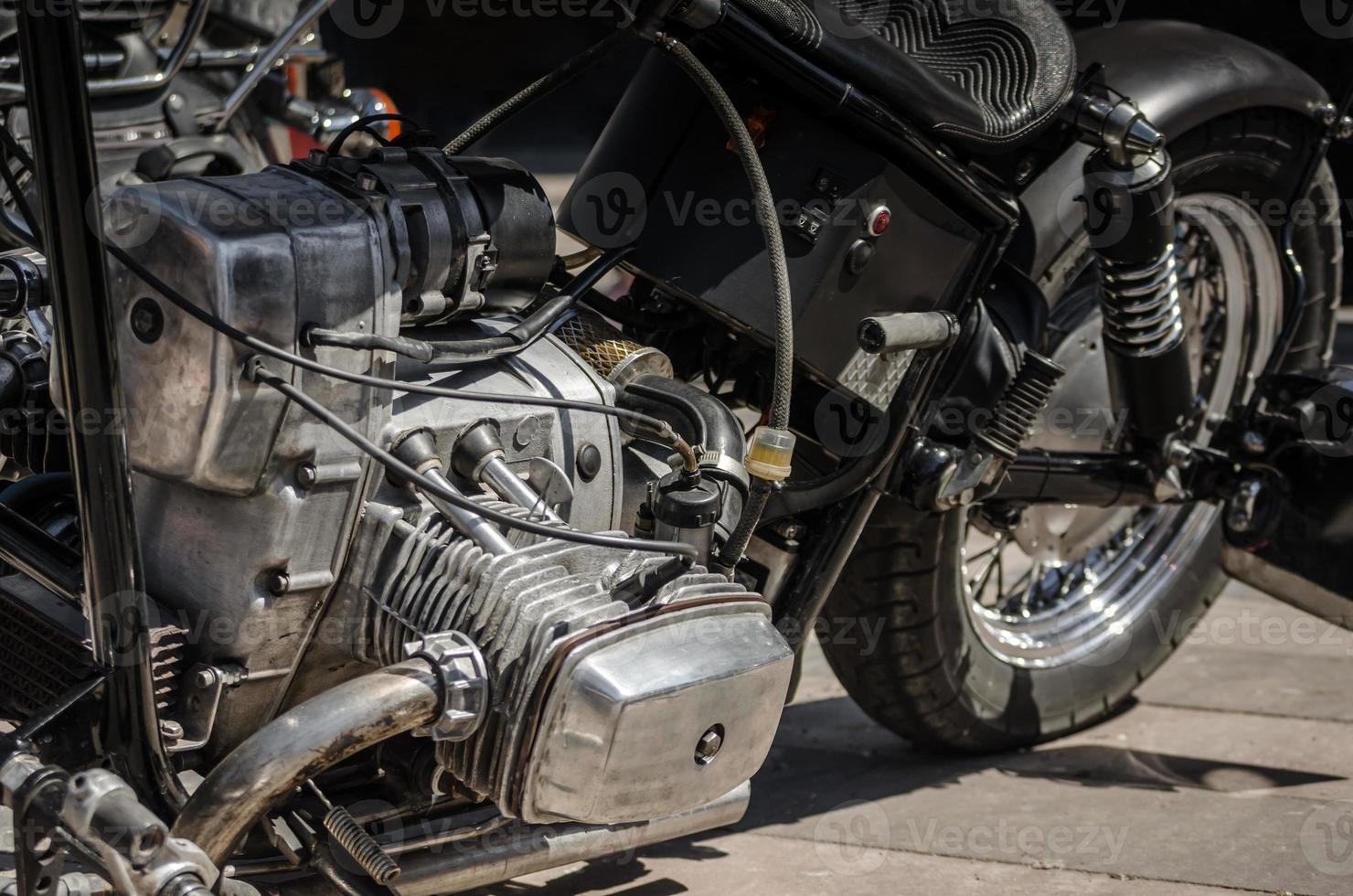 Old chopper motorcycle engine close up photo