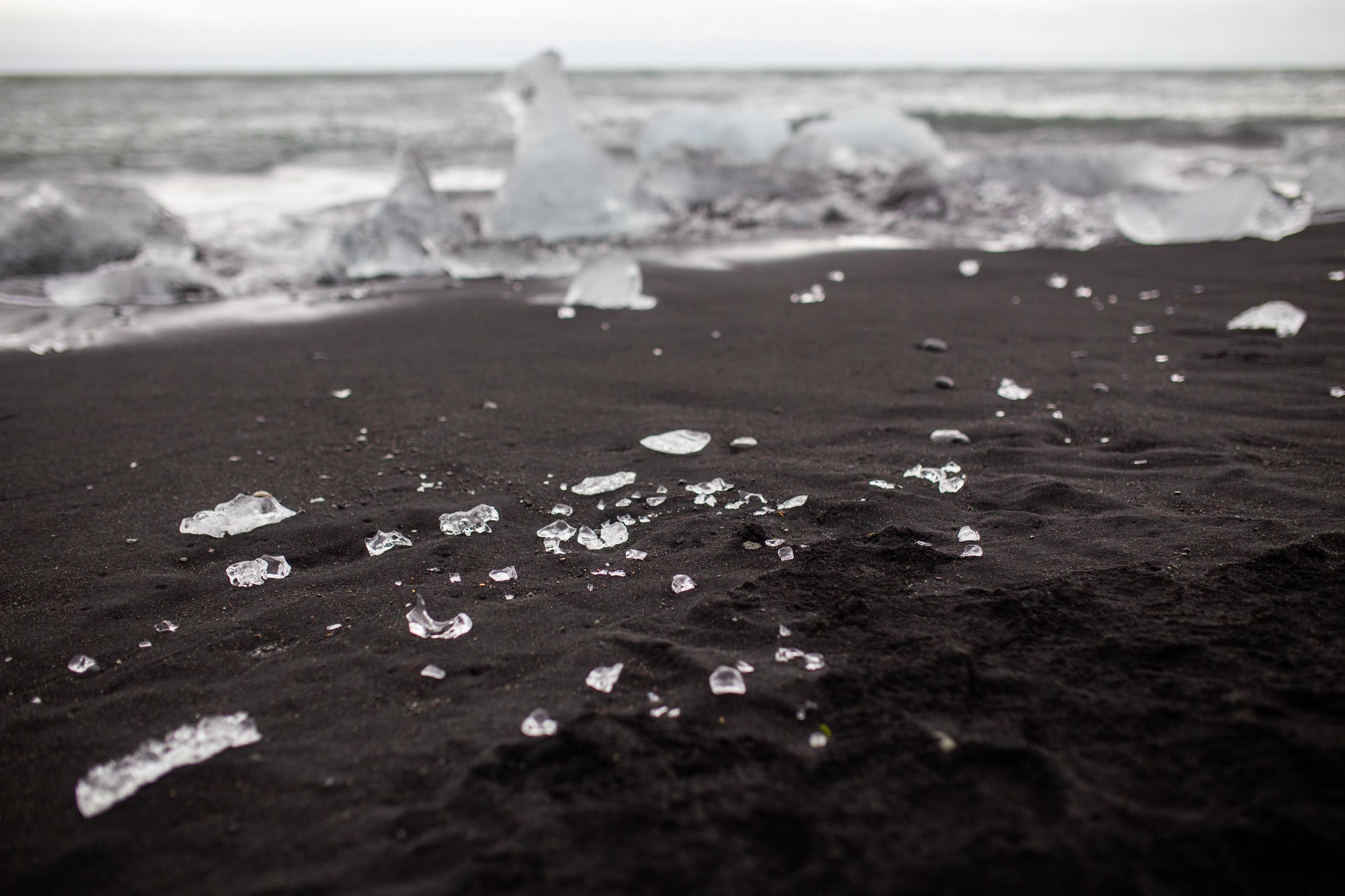 Small ice pieces on black sand beach in Vik, Iceland 2221503 Stock Photo at  Vecteezy