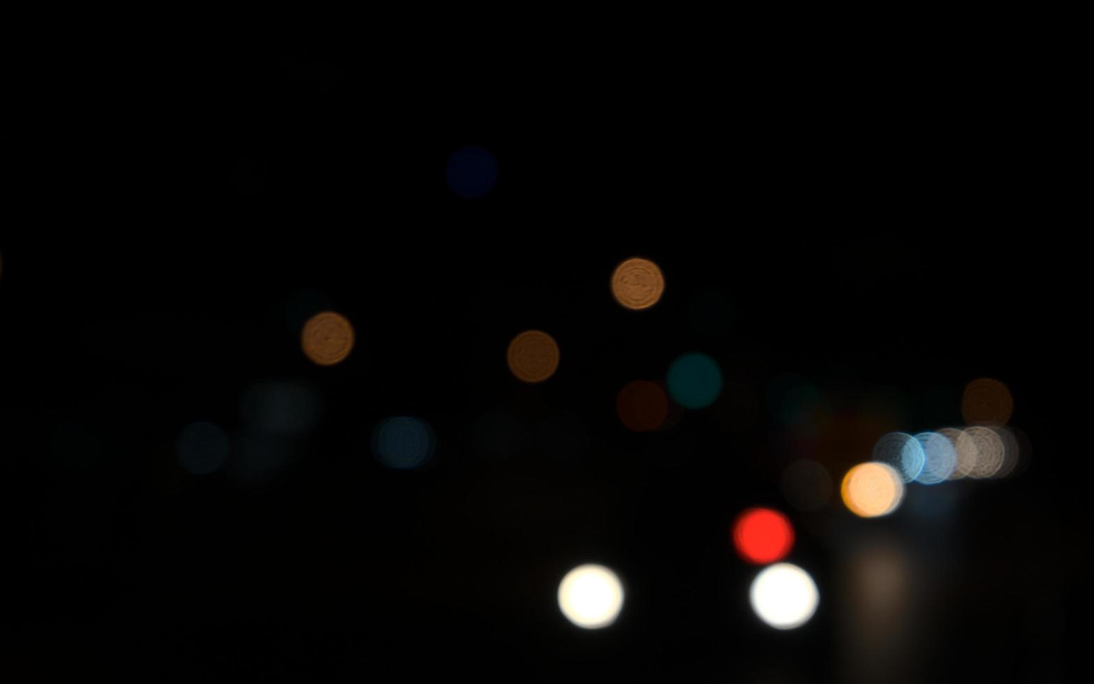 Bokeh of car lights at night in the city photo