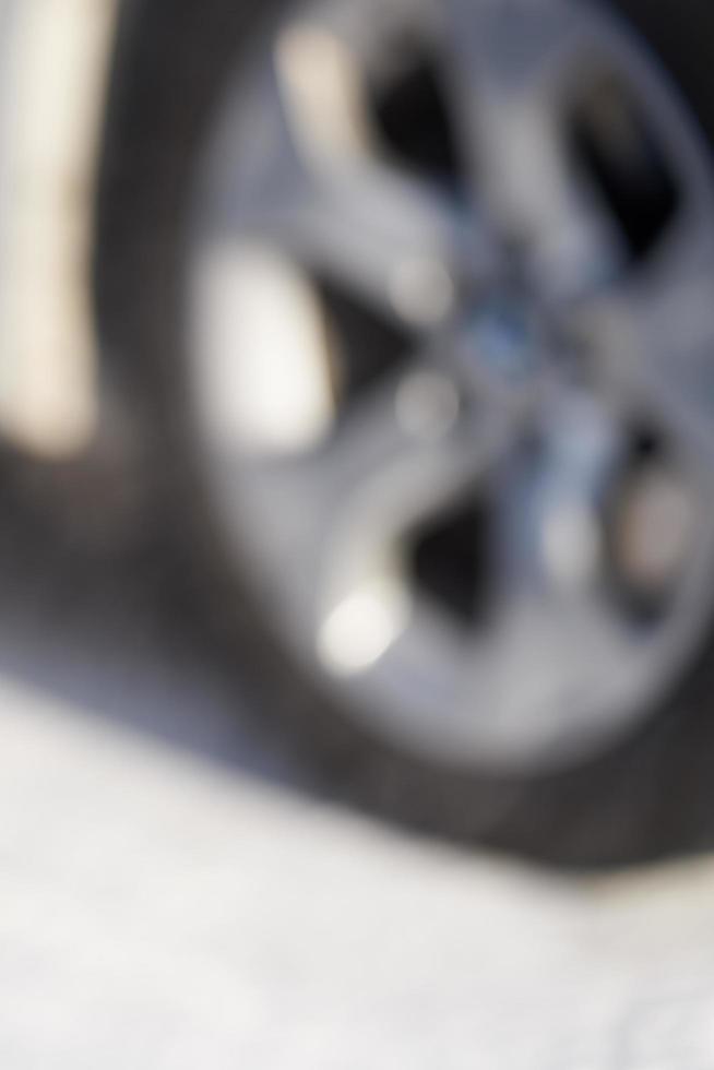 Blurry car wheel background photo