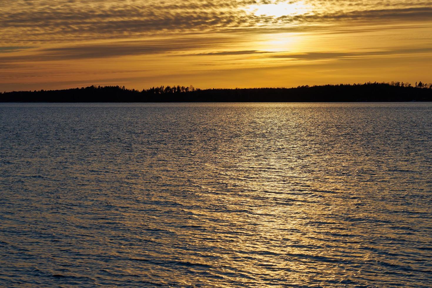 Golden sunlight on water photo