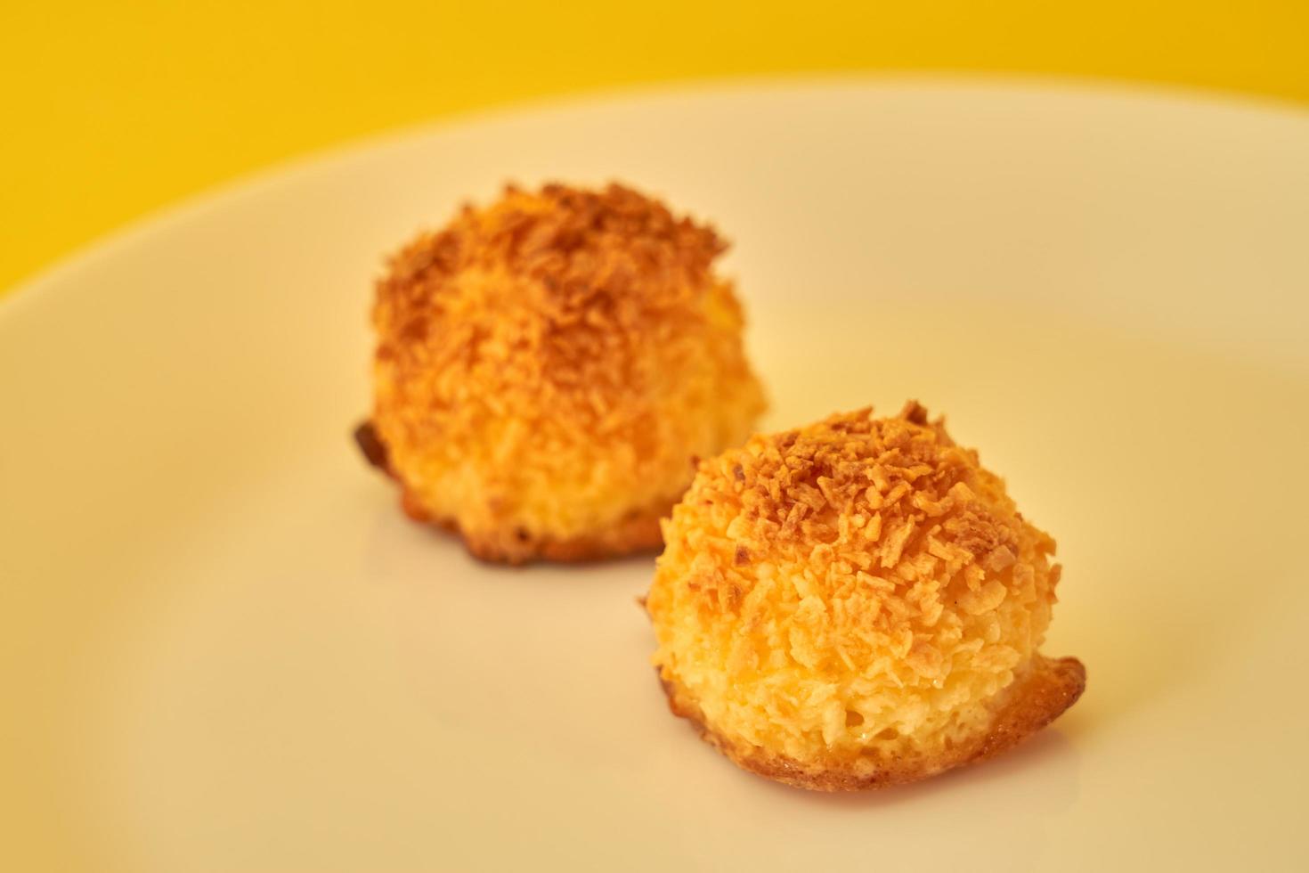 Coconut cookies on a white plate photo