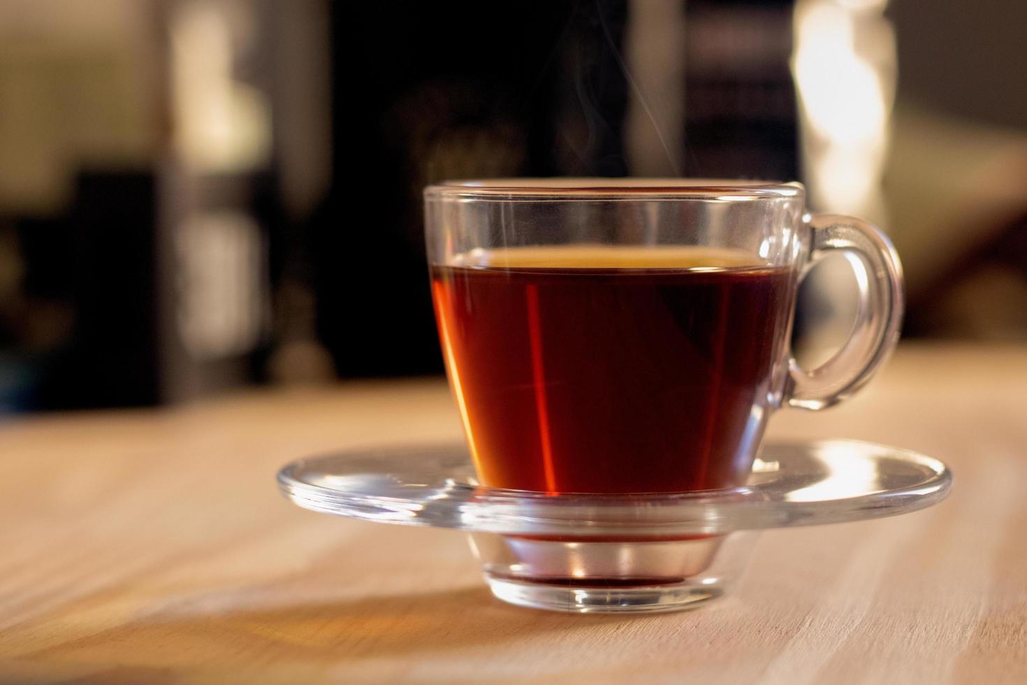 Cup of tea in a clear glass photo