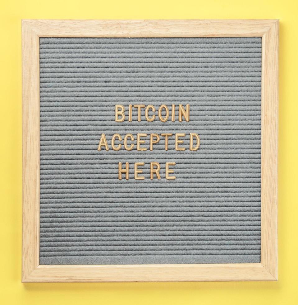 Letter-board with text Bitcoin Accepted Here. Concept of bitcoin payment, shopping or purchase and cryptocurrency accepted photo