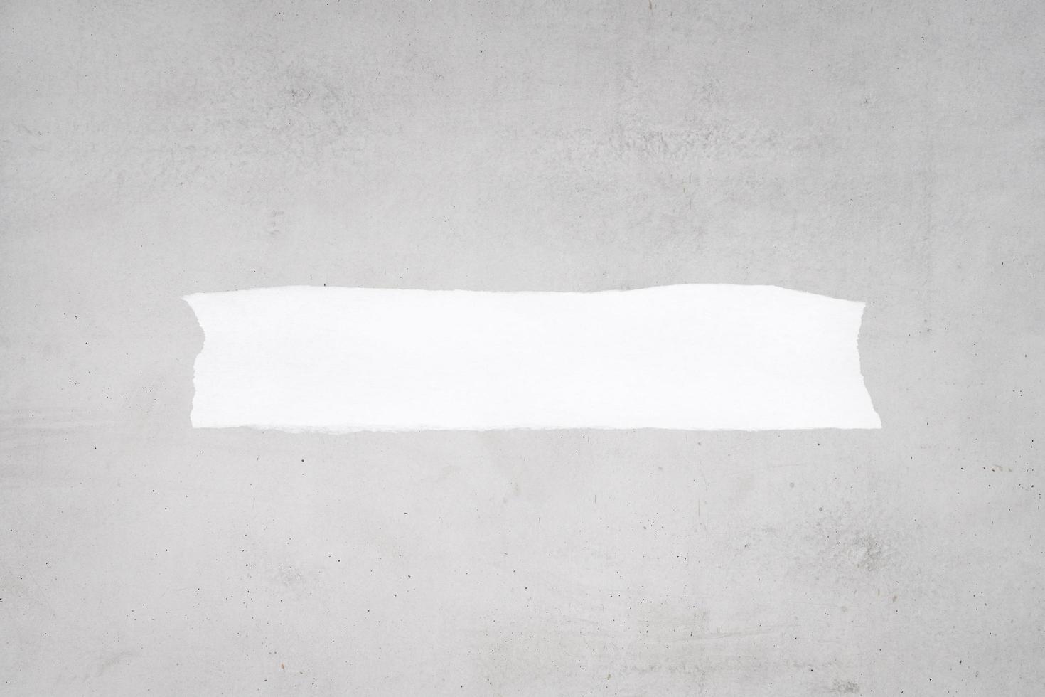Blank ripped white paper on a gray concrete background to add text. Mock up template photo