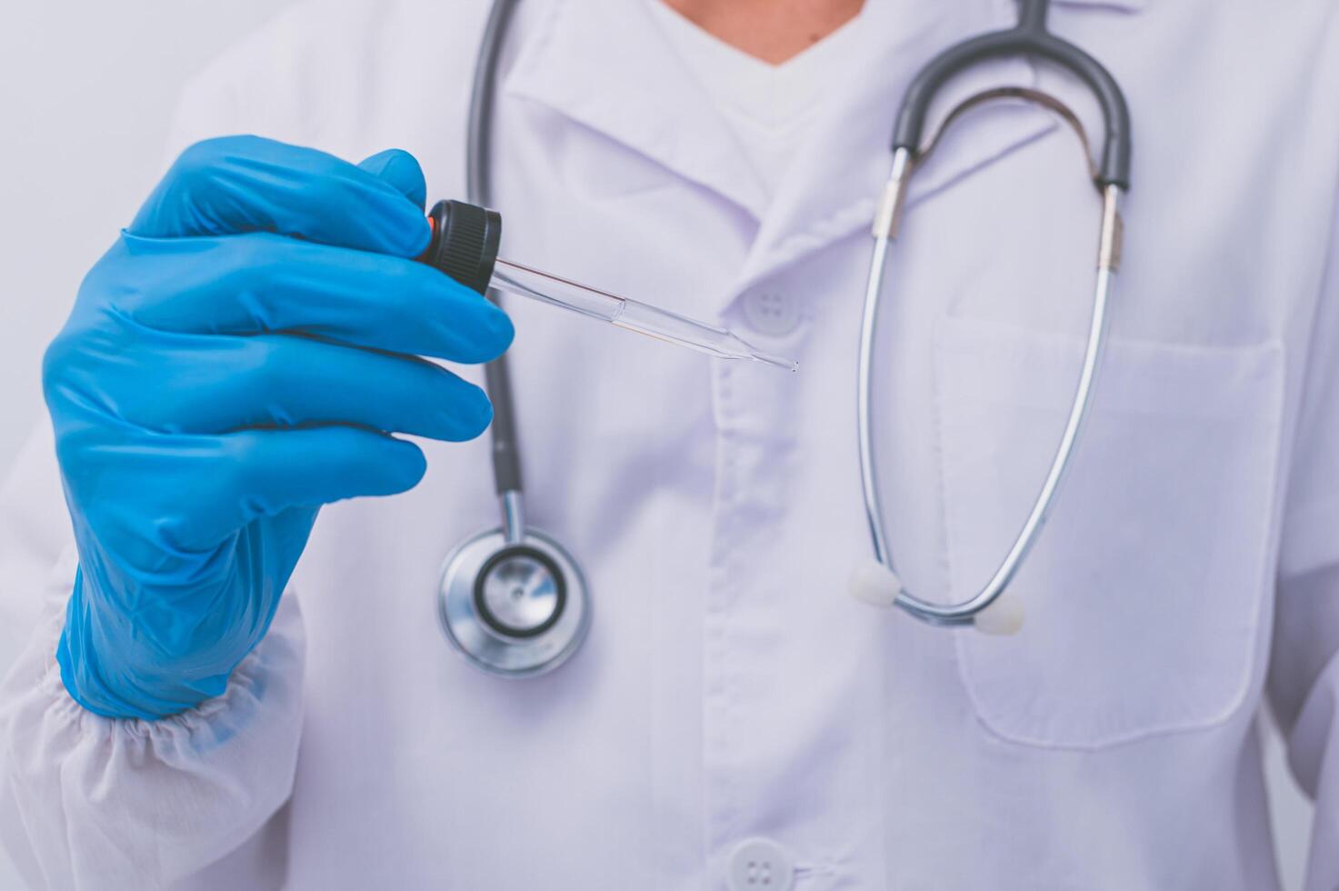 The doctor is using a vaccine to prevent germs photo