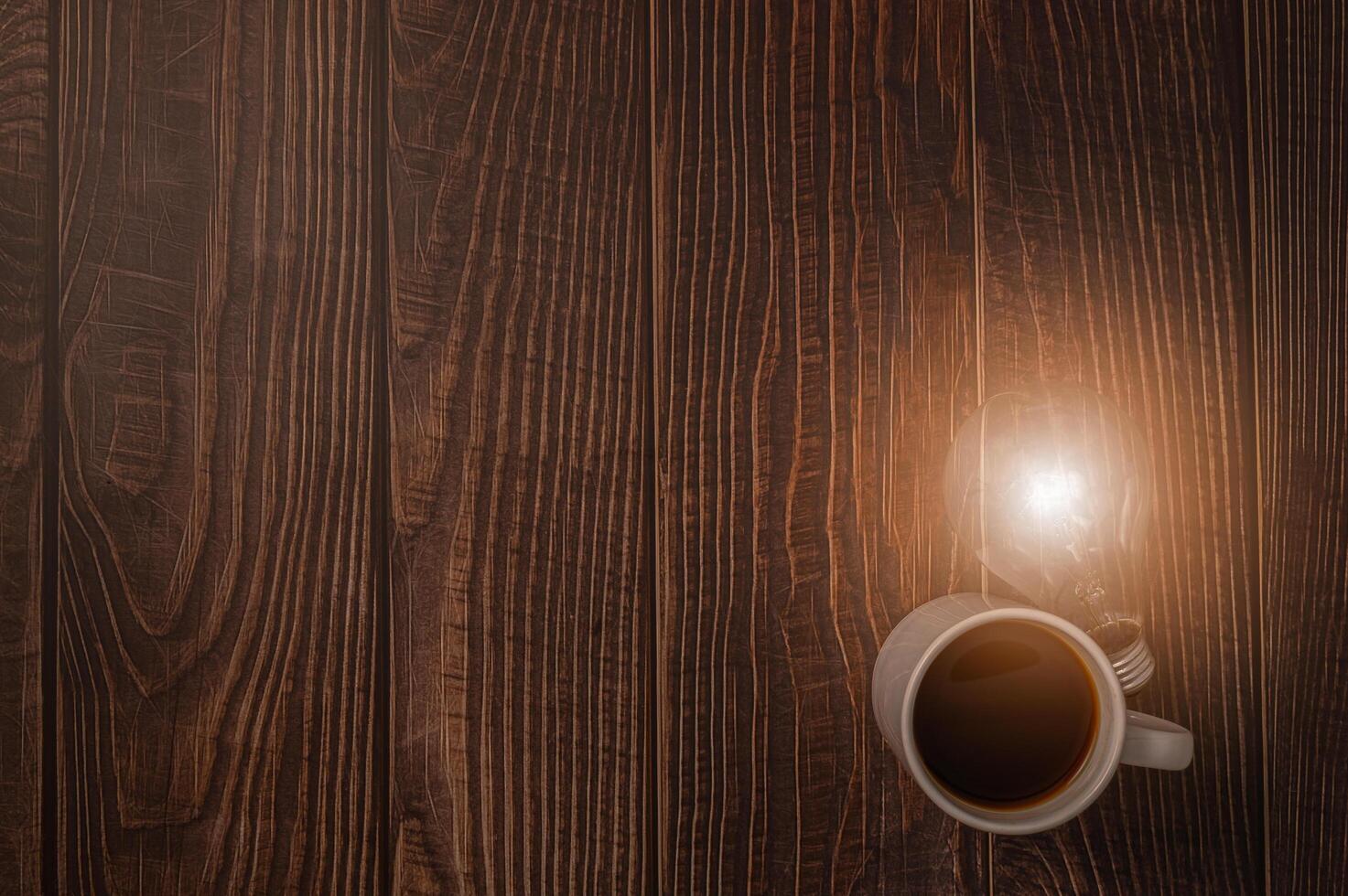 Love drinking coffee, coffee cup and light bulb emitting energy photo