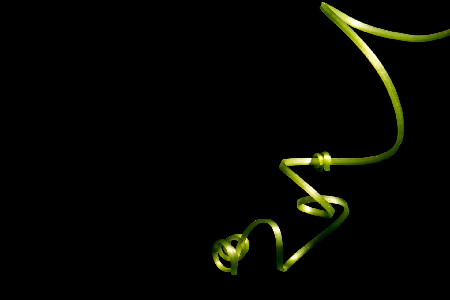Top of a gourd on a black background photo