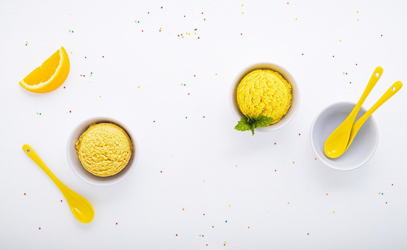 Various ice cream flavor balls on a white wooden background. Summer and sweets menu concept. photo