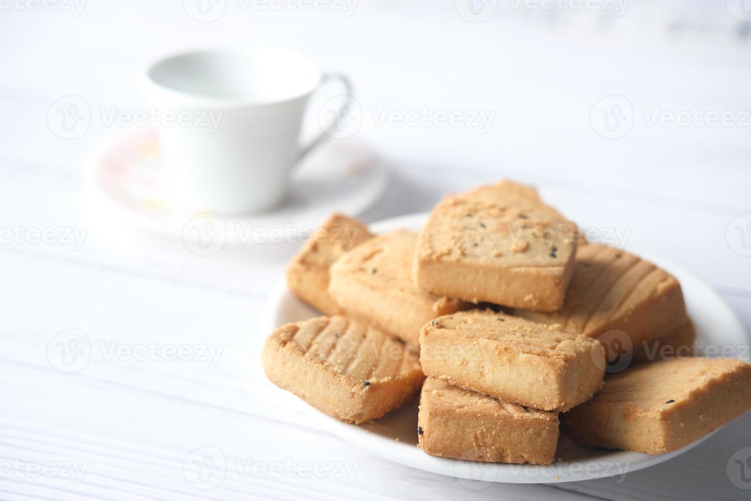 Close up of cookies and tea on table photo