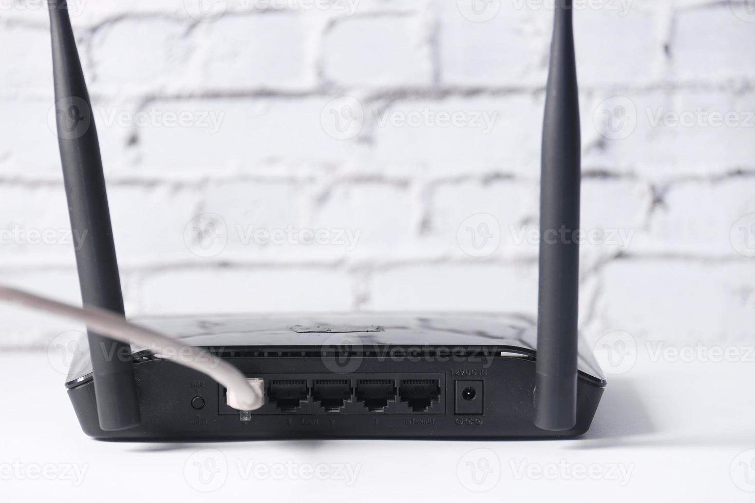 Wi-Fi wireless internet router on white background photo
