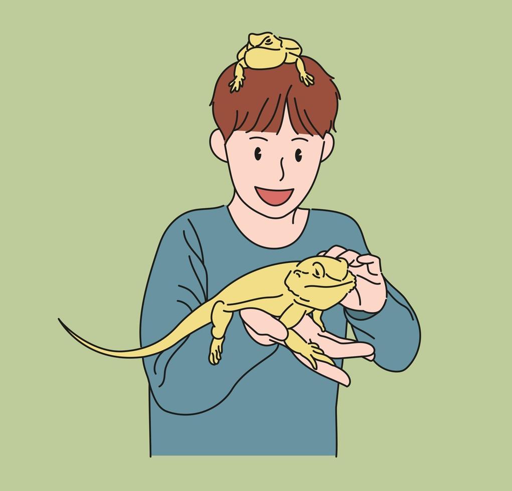 A boy is playing with his pet lizard on his hand. hand drawn style vector design illustrations.