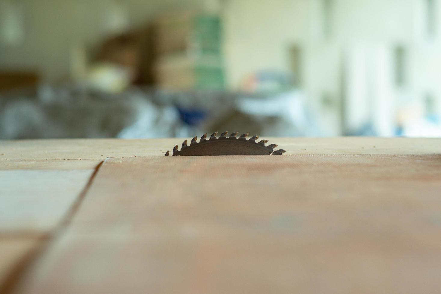 Closeup of metal electrical saw machine in the table at the factory photo