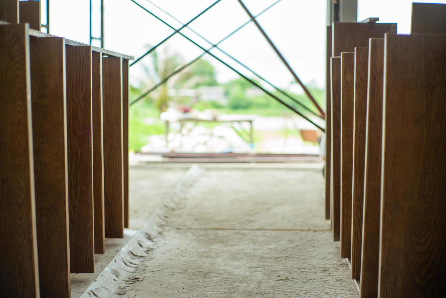 Selective focus on wooden laminated board at the factory waiting for installation photo