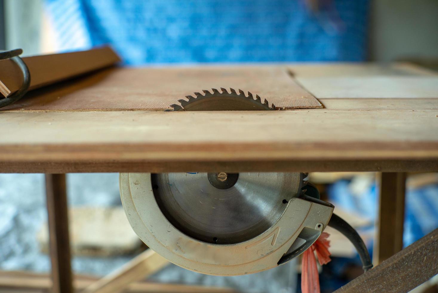 Close-up of metal dish of electrical saw machine in the table at the factory photo