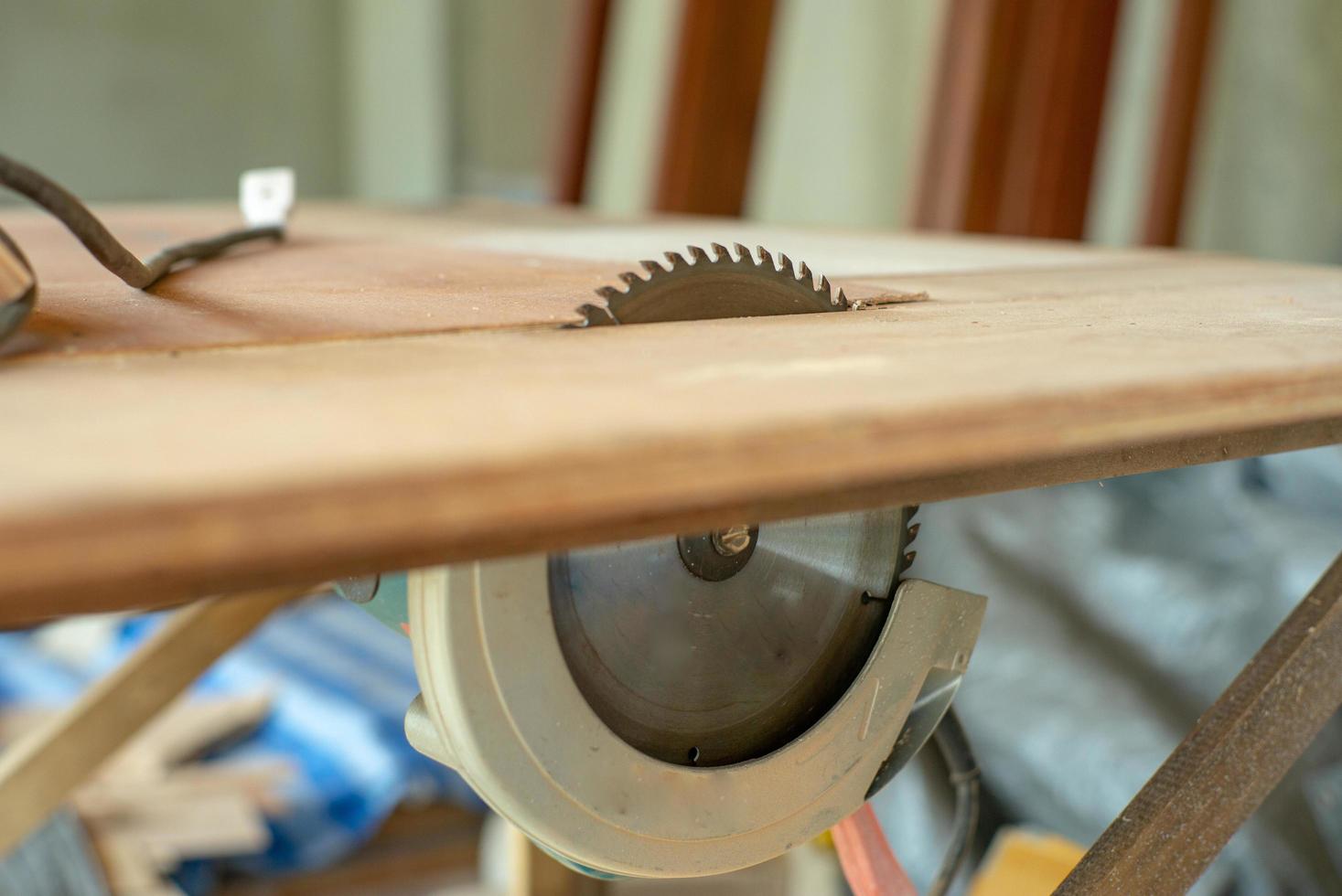 Close-up of metal dish of electrical saw machine on the table at the factory photo