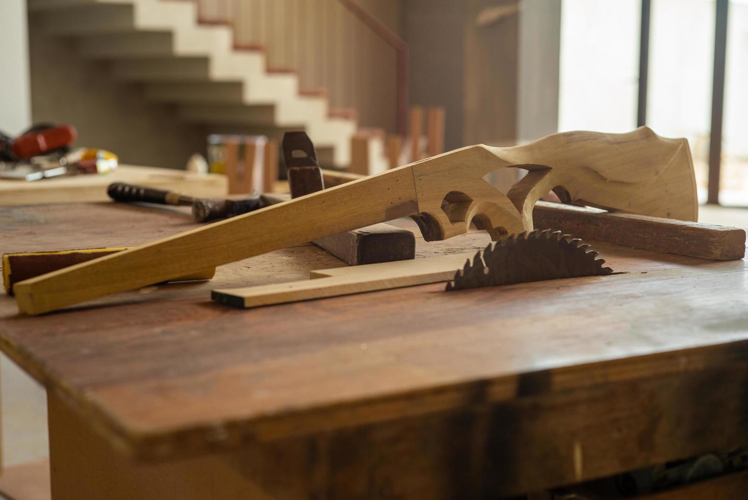 Selective focus on wooden gun shape at factory photo