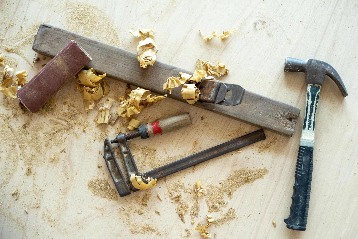 Top view of carpenter tools with sawdust photo