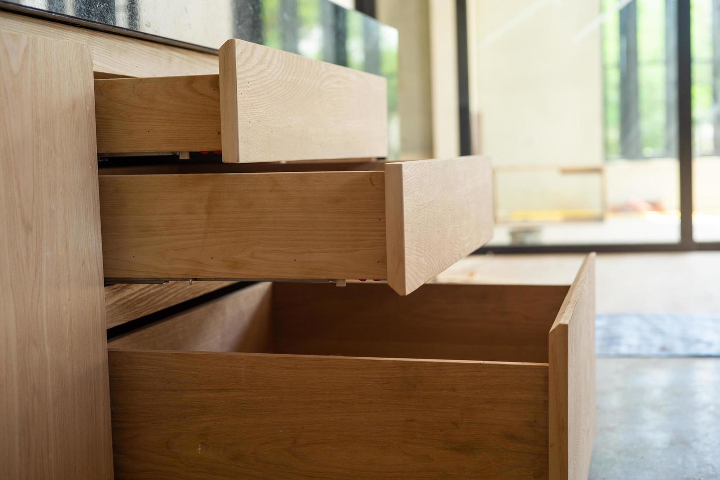 Opening wooden shelfs under installation inside the house under construction photo