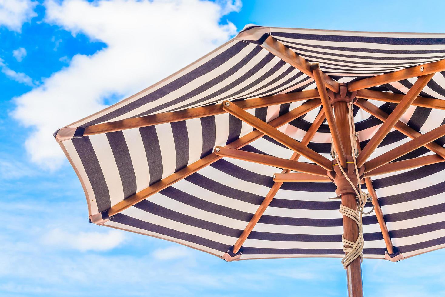 Umbrella under blue sky photo