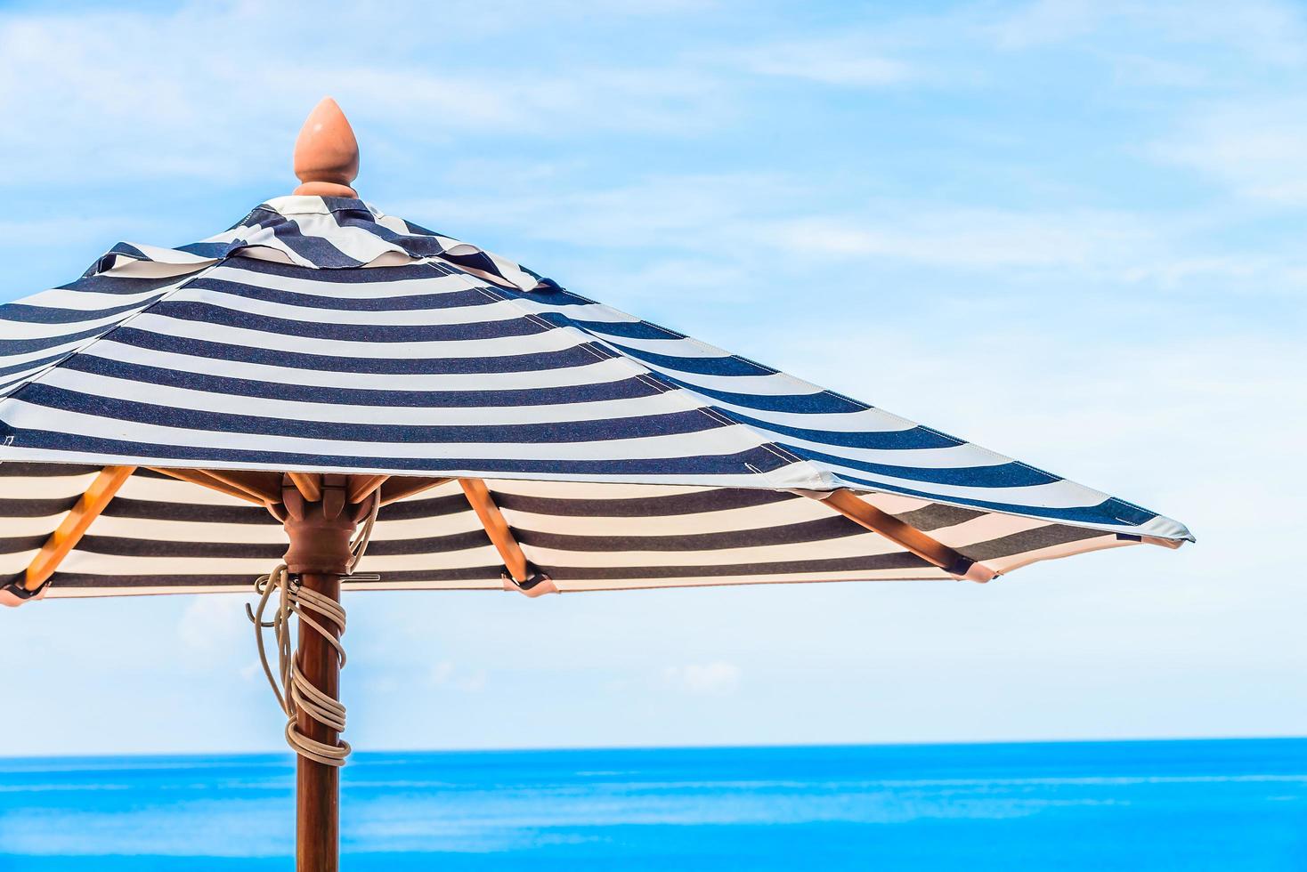 Umbrella under blue sky photo