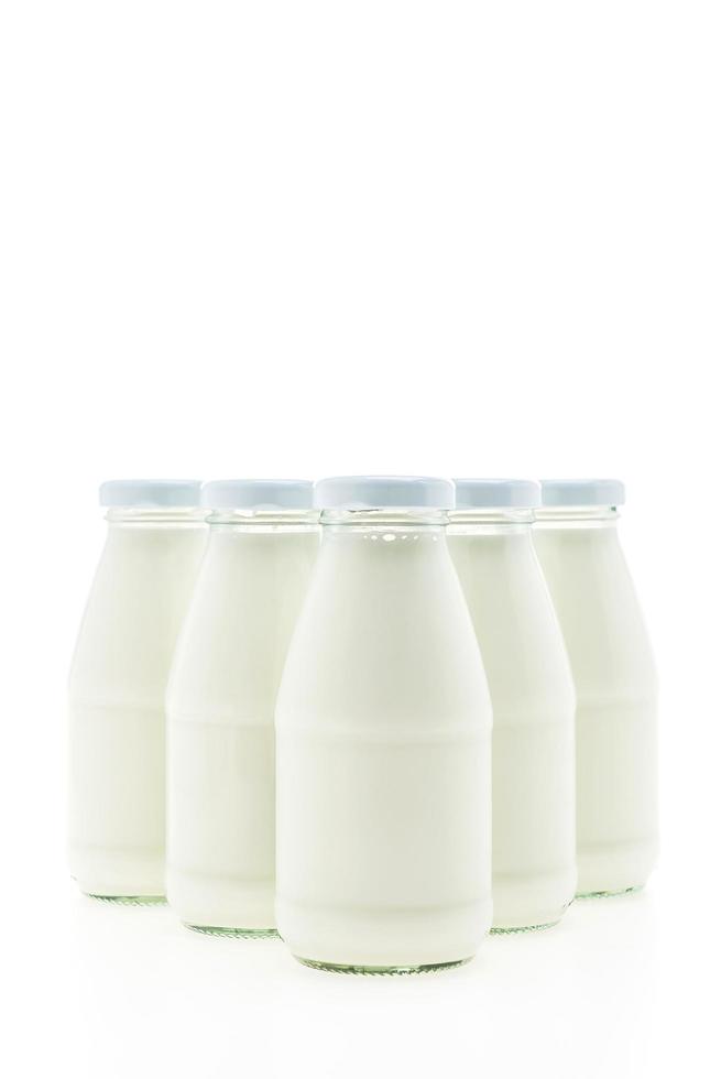 Milk bottle glass isolated on white background photo