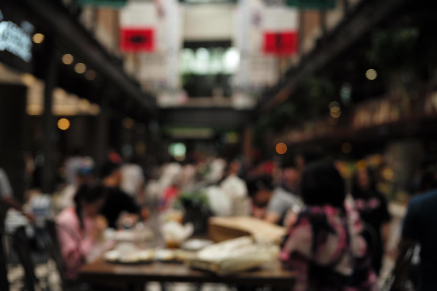 Blurred crowd of people in the public place photo