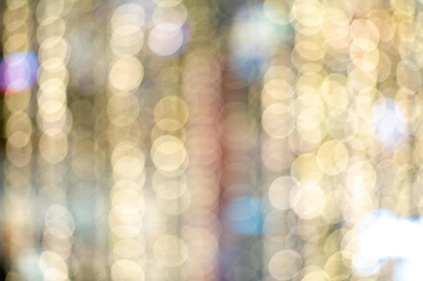 Blurred colorful glittering bokeh lights background photo