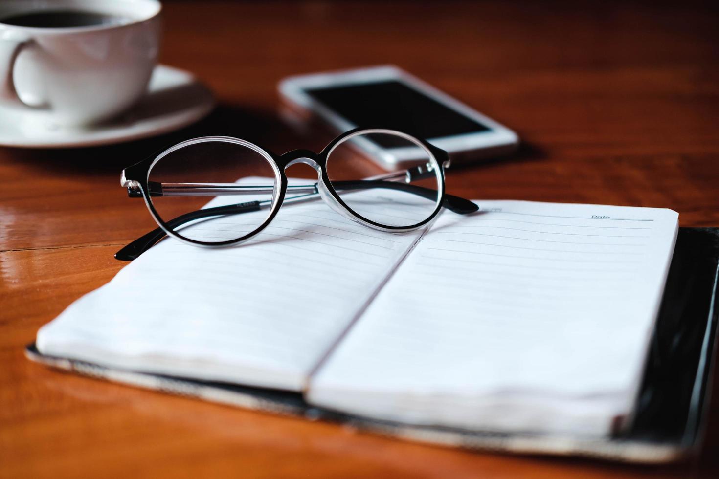 Reading glasses on a notebook photo