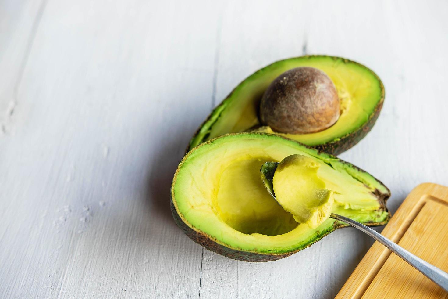 Spoon with avocado photo