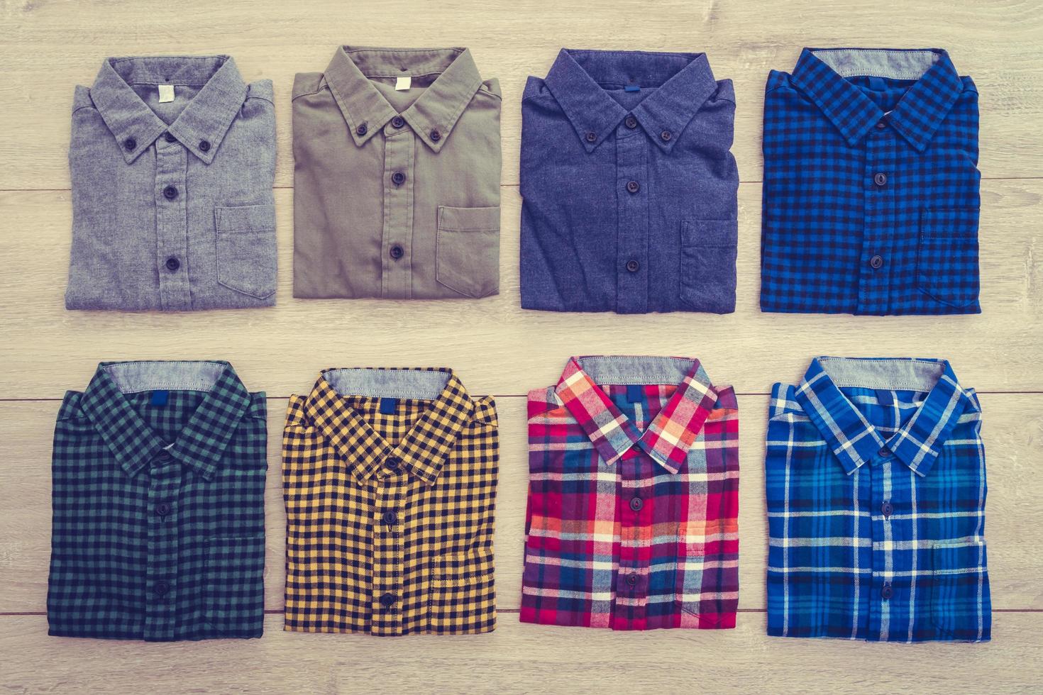 Shirts on wooden background photo