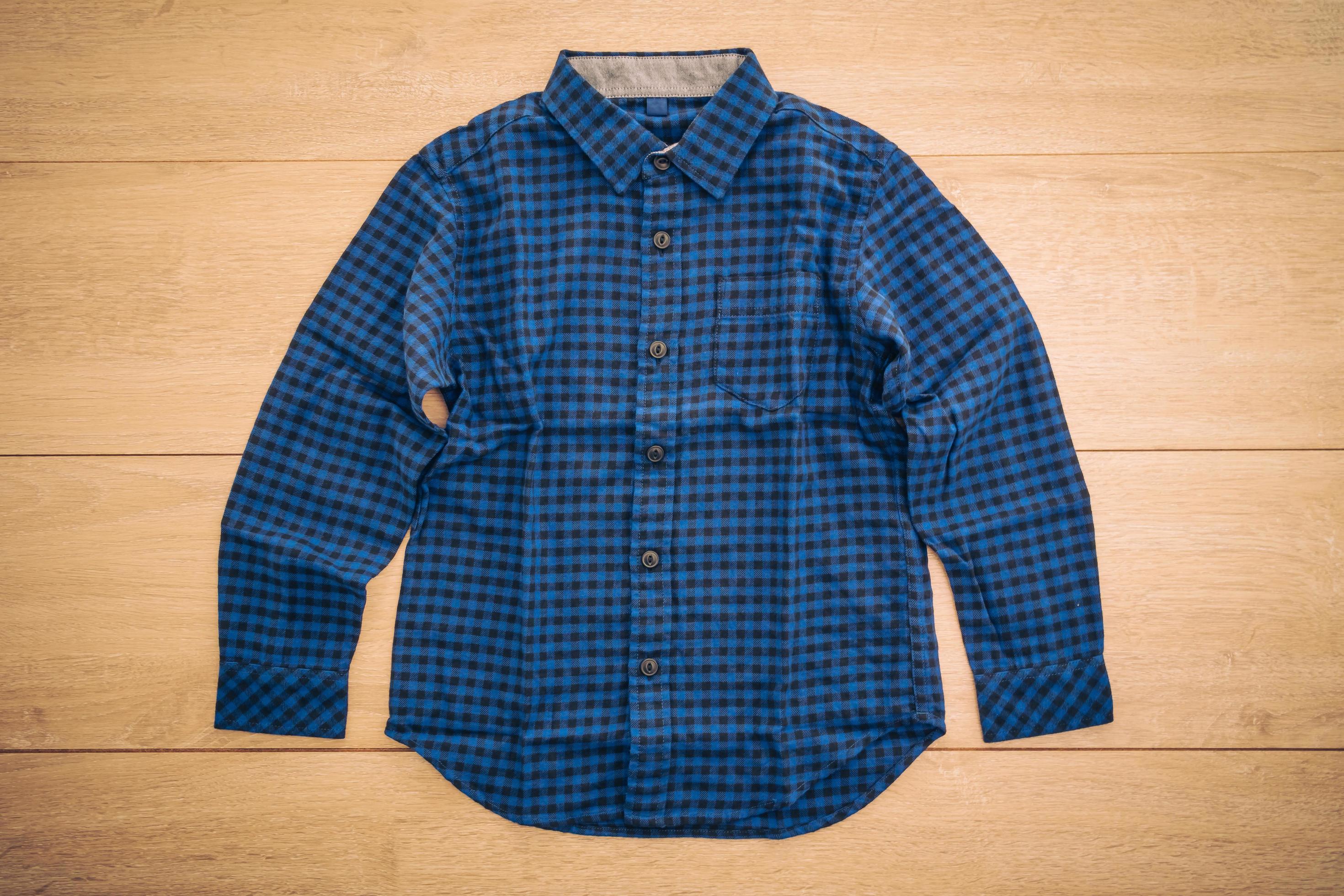 Shirt on wooden background 2230997 Stock Photo at Vecteezy